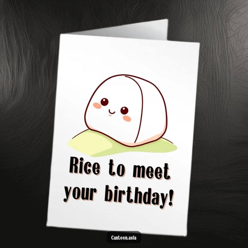 Funny free printable birthday card: a smiling onigiri with a happy face joyfully rolling down a gentle grassy slope.